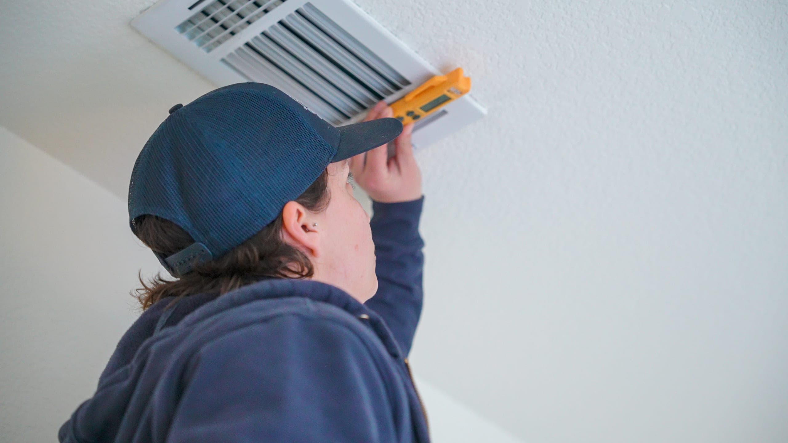 Balanced Comfort technician replacing an air filter